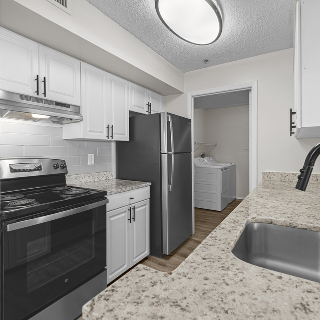 The Park at Veneto - Modern Kitchen Featuring White Cabinets