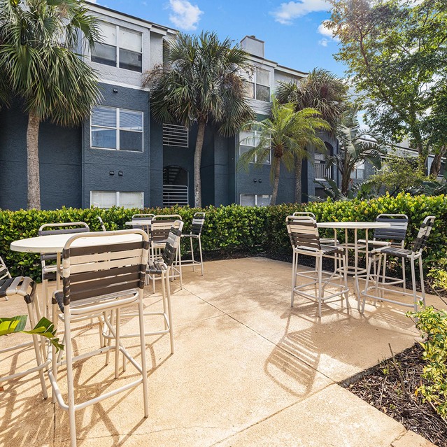 The Park at Veneto - Outdoor Seating Area with Metal Tables and Chairs