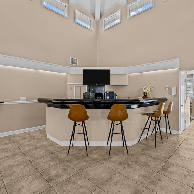 The Park at Veneto - Bright Lobby Featuring a Curved Black Reception Desk