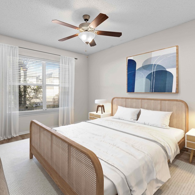 The Park at Veneto - A Cozy Bedroom Featuring a Queen Bed